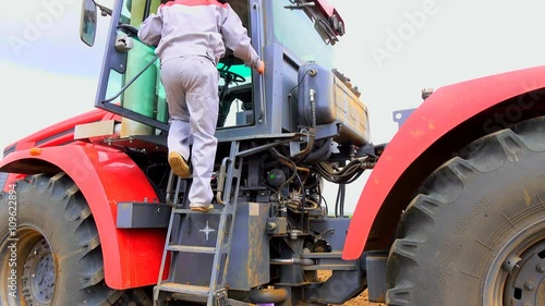 climbs to the tractor