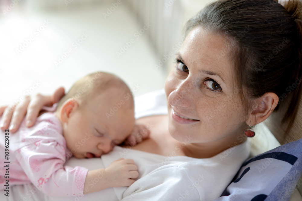Close up of mother holding her cute baby daughter Close up of mother holding her cute baby daughter