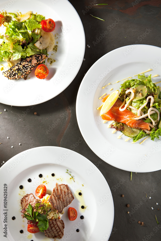 Various Salad on Black Stone Background Various Salad on Black Stone Background