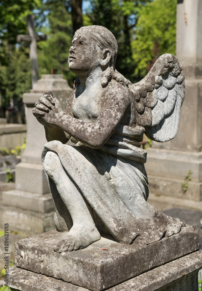 Old statue on grave