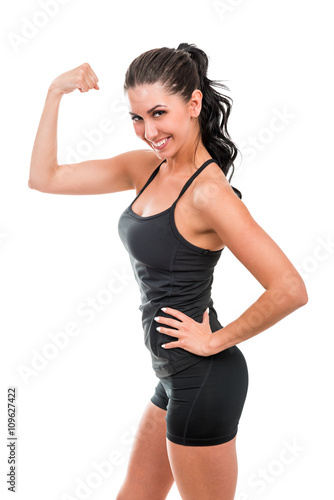Portrait of athletic beautiful cheerful woman on a white background