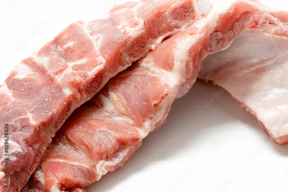 Close up of Raw Pork Ribs Isolated On White Background Close up of Raw Pork Ribs Isolated On White Background