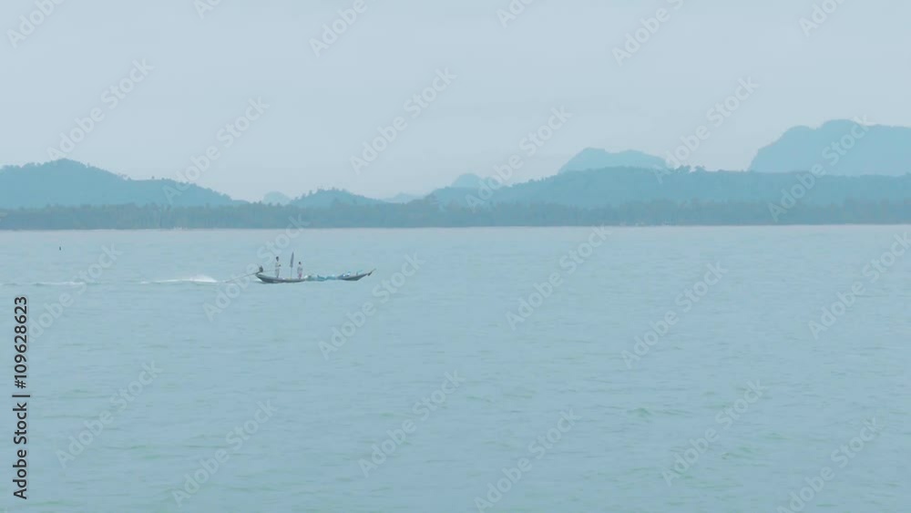 Single fishing boat on the beach. Beautiful shot in Chumphon .Thailand Single fishing boat on the beach. Beautiful shot in Chumphon .Thailand