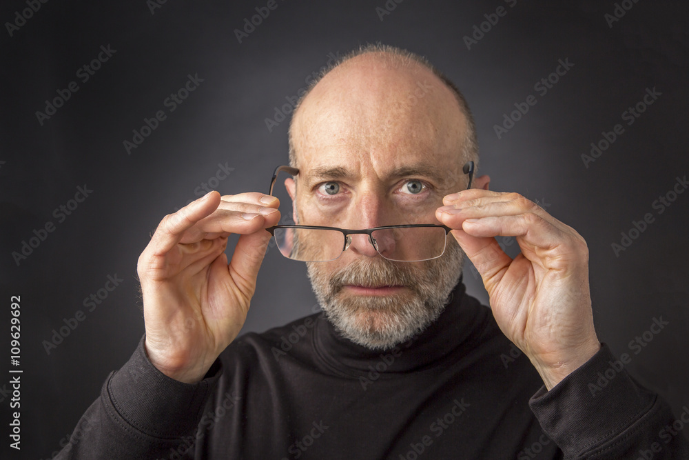 Fototapeta premium look over reading glasses