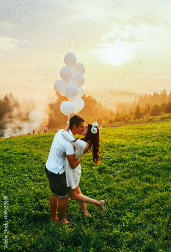 Attractive Couple Enjoying Romantic Sunset Picnic in the Countryside