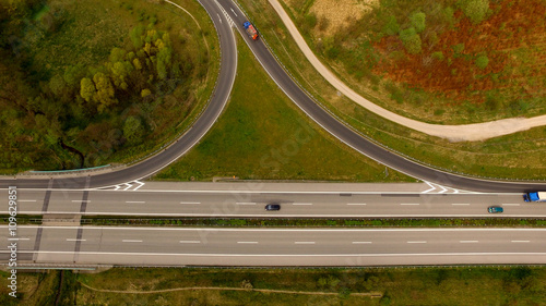 highway between woods viewed from the air - Aerial view