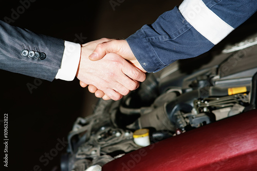 Auto mechanic handshake