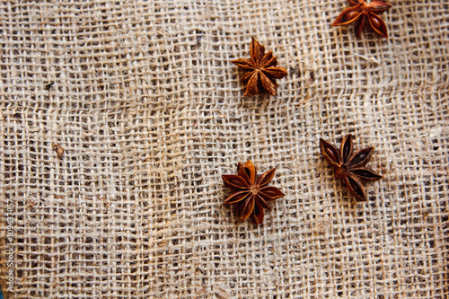 Food Background with fragrant spices Close-up of Star Anise on burlap