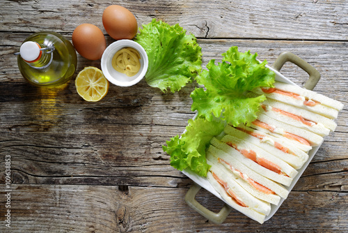 tramezzini al salmone e ingredienti maionese photo