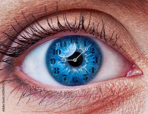 Blue woman eye with clock - concept photo photo