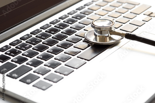 doctor workplace with a stethoscope at wooden table