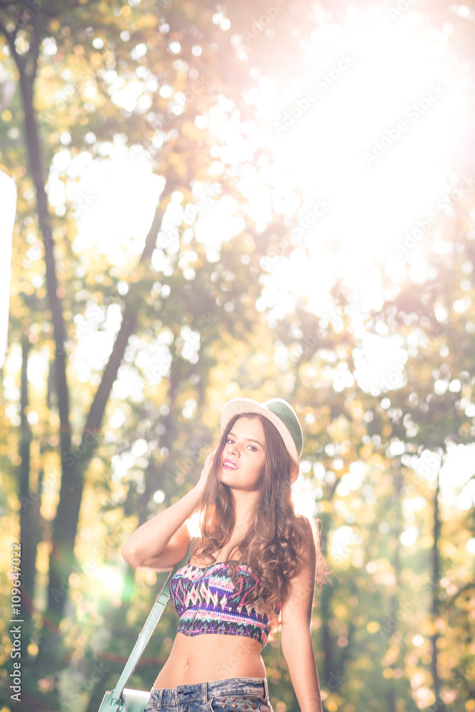 Naklejka premium Fashion teen girl with hat and purse