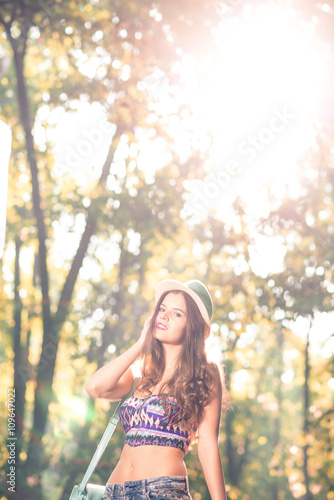 Fashion teen girl with hat and purse