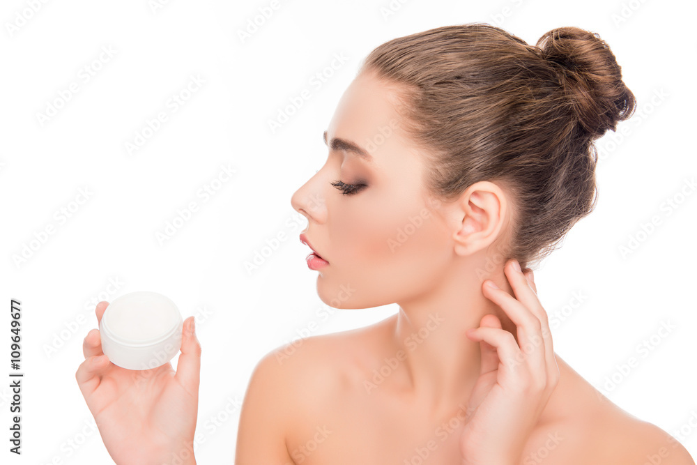 Portrait of beautiful woman holding jar of cream for face Portrait of beautiful woman holding jar of cream for face