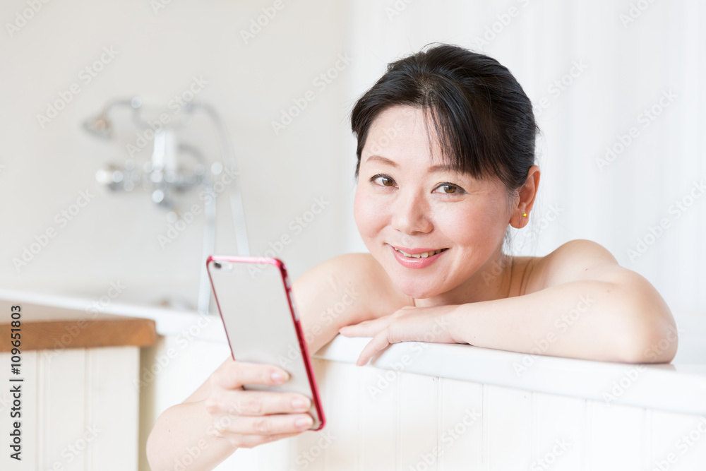 attractive asian woman relaxing in the bathtub attractive asian woman relaxing in the bathtub
