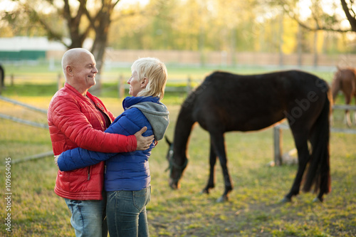 happy seniors couple embrace and smile;