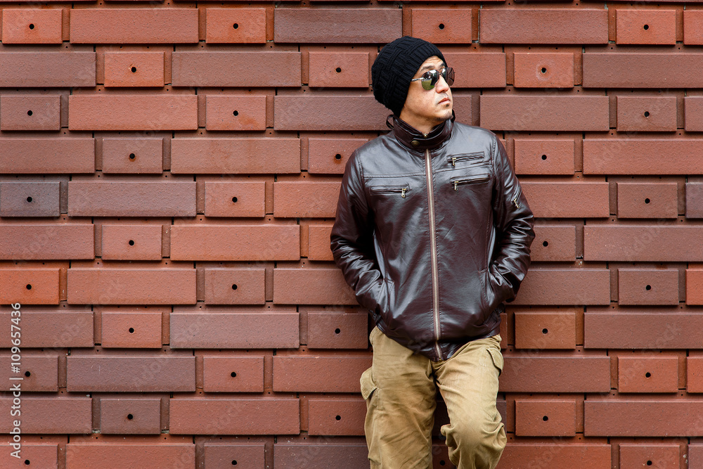 An Asian Man in a Brown Jacket An Asian Man in a Brown Jacket