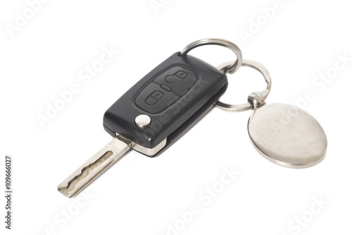 Remote control car key with metal keyring on isolated white back
