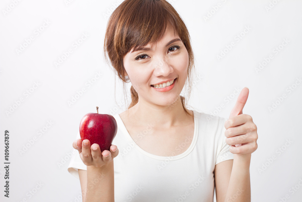 healthy woman giving thumb up with red apple healthy woman giving thumb up with red apple