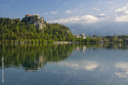Lake Bled with the rocktop castle and St Martin church © haidamac
