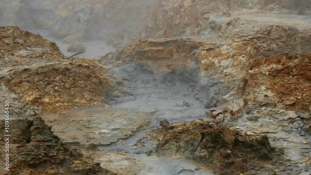 Steaming and bubbling mud pot on the barren solfatara fields of Namafjell Hverir near Myvatn and the Krafla area, Iceland Steaming and bubbling mud pot on the barren solfatara fields of Namafjell Hverir near Myvatn and the Krafla area, Iceland