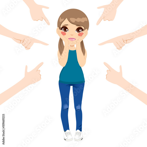 Cute teenager girl being accused with fingers pointing at her