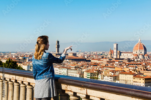 Young girl enjoying the panoramic view of Florence, Tuscany, Italy