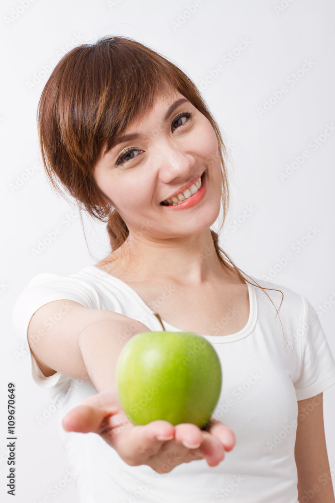 green apple in hand of healthy asian woman green apple in hand of healthy asian woman