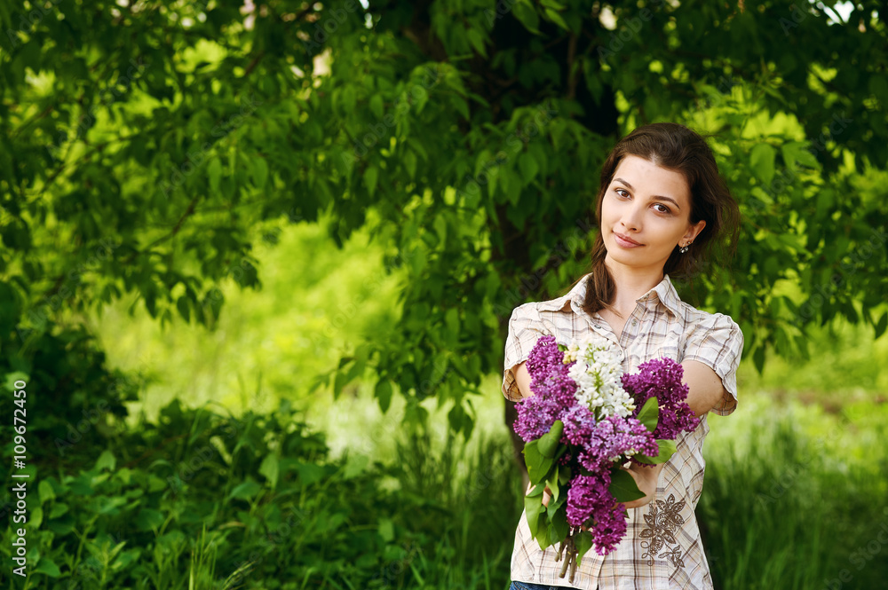 Beautiful girl with a lilac flowers Beautiful girl with a lilac flowers