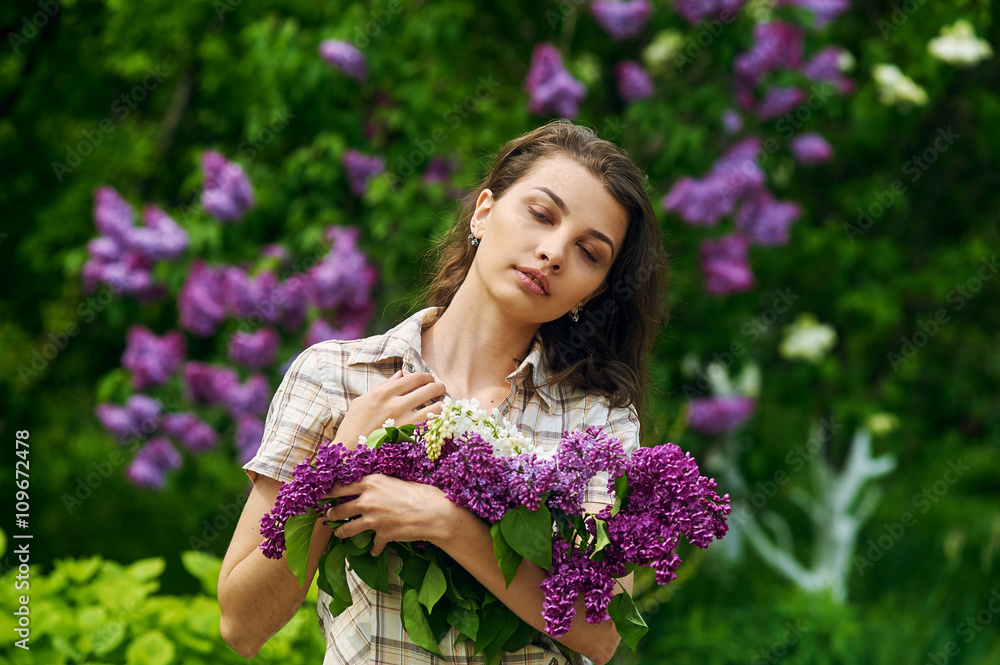 Beautiful girl with a lilac flowers Beautiful girl with a lilac flowers