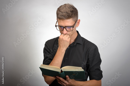 Close up of man reading book