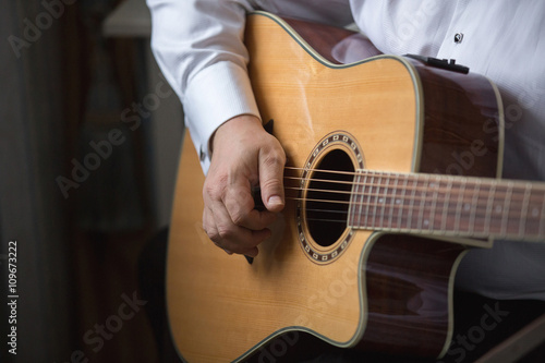 guitarist playing guitar, hotel room