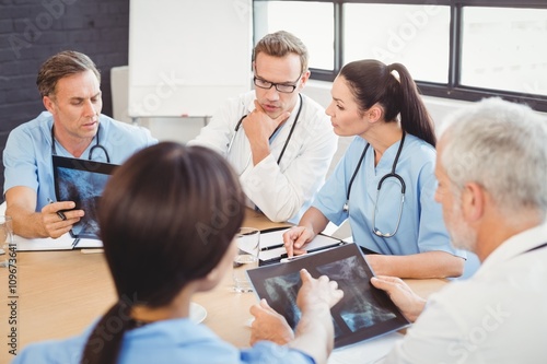 Medical team examining an x-ray report