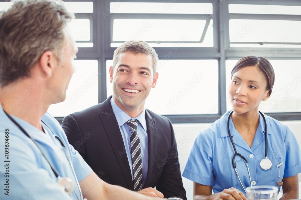 Medical team interacting in conference room Medical team interacting in conference room