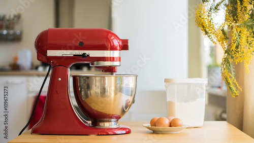 red stand mixer mixing cream photo