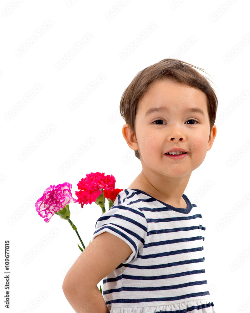 Smiling girl hiding a bouquet of red carnations behind itself, i Smiling girl hiding a bouquet of red carnations behind itself, i