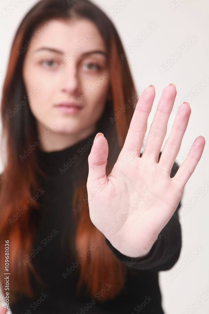 Girl showing stop hand sign gesture (Body language, gestures, ps Girl showing stop hand sign gesture (Body language, gestures, ps