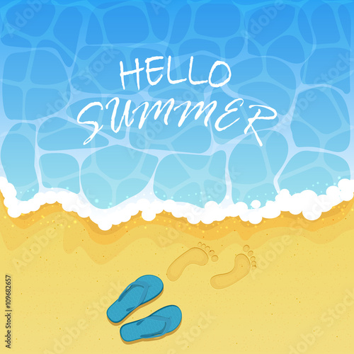 Flip flops and footprints on the beach