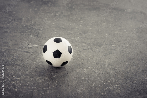 Miniature soccer ball toy still life. Concept of sport  leisure activity and football.