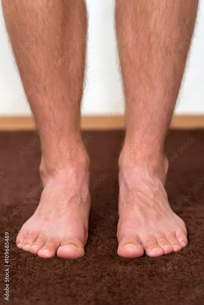Healthy male feet feeling comfortable at home. Healthy male feet feeling comfortable at home.