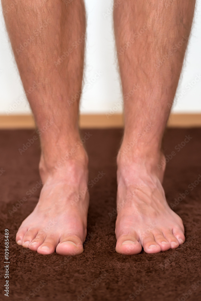 Healthy male feet feeling comfortable at home.