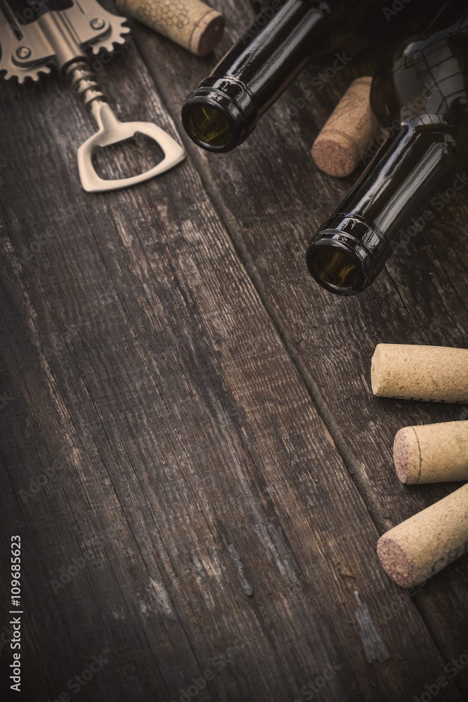 Bottle of wine,  corks and corkscrew
