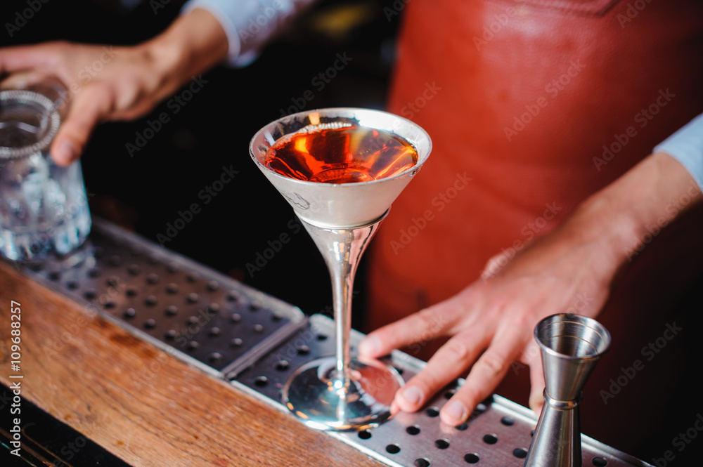 orange cocktail on  bar setting