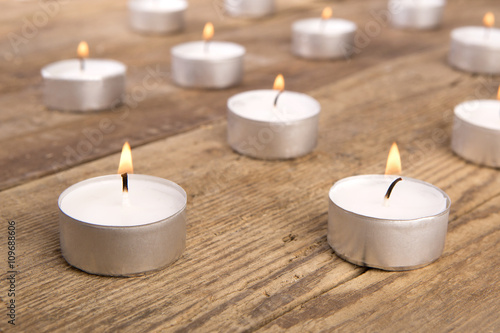 Candles on wooden background