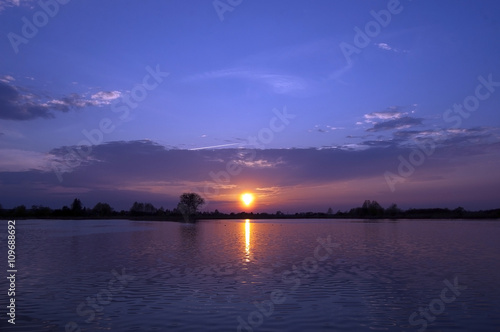 Blue sky during sunset over the lake