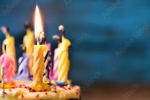 Фотография blowing out the candles of a cake
