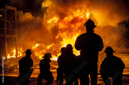 Firefighters fighting burning blaze