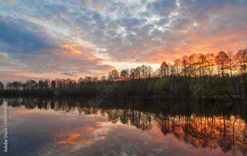 Beautiful landscape. Bright stunning sunset on the river