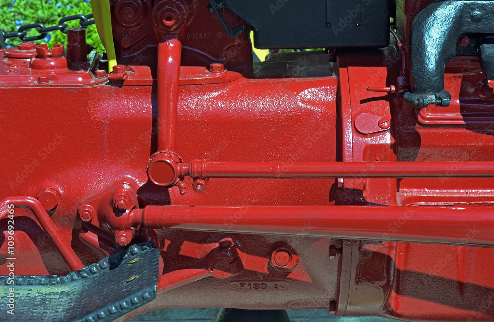 Close-up of motor and transmission system of ancient tractor Close-up of motor and transmission system of ancient tractor