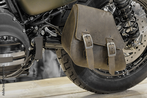 Close-up of leather single-sided swingarm bag of motorcycle photo